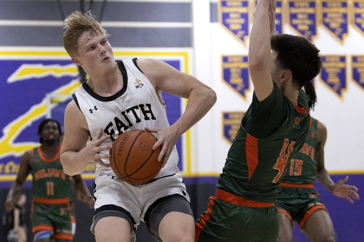 Faith Lutheran’s Layton Barr drives around Mojave’s Casen Lochridge (4) during a ...