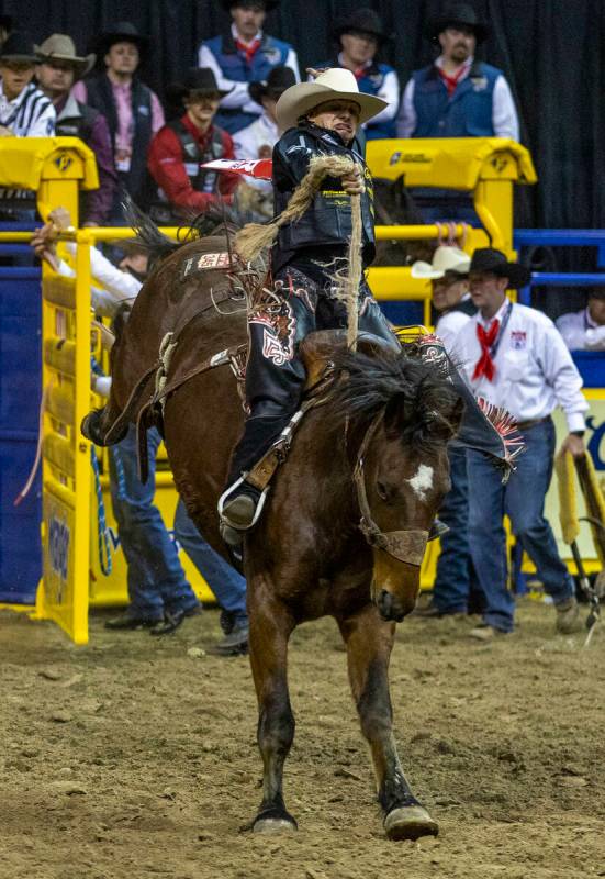 Lefty Holman of Visalia, CA., rides Wall Street to a winning score in Saddle Bronc Riding durin ...