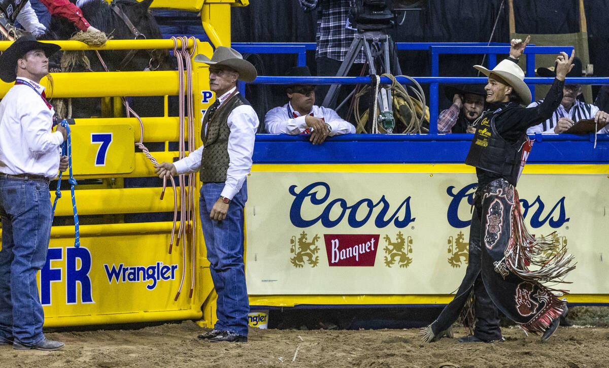 Lefty Holman of Visalia, CA., celebrates after riding Wall Street to a winning score in Saddle ...