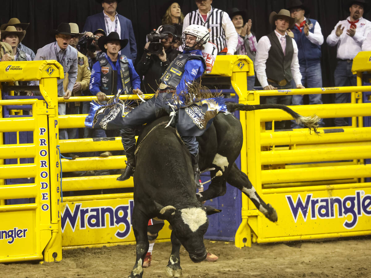 Stetson Wright, of Milford, Utah, rides Relentless while competing in bull riding during the fi ...