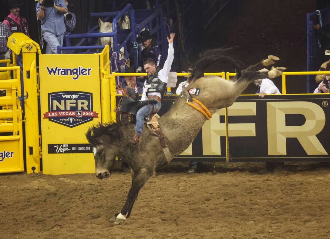 Garrett Shadbolt, of Merriman, Neb,. competes in bareback riding during the fifth go-round of t ...