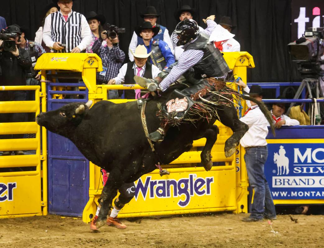 Trey Holston, of Fort Scott, Kan., rides Time for Magic while competing in bull riding during t ...