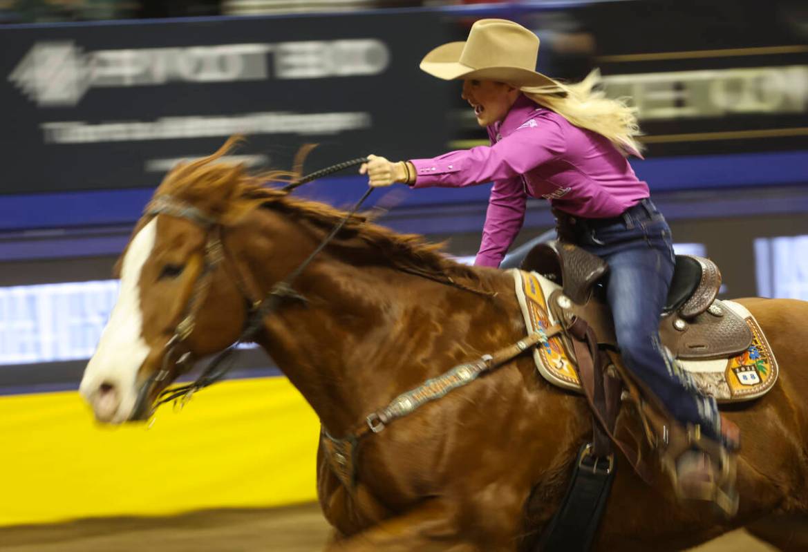 Sissy Winn, of Chapman Ranch, Texas, competes in barrel racing during the fifth go-round of the ...