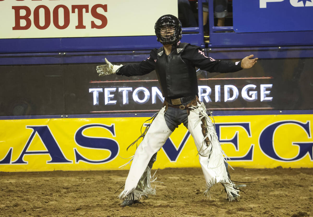 Trey Kimzey, of Strong City, Okla., reacts after competing in bull riding during the fifth go-r ...