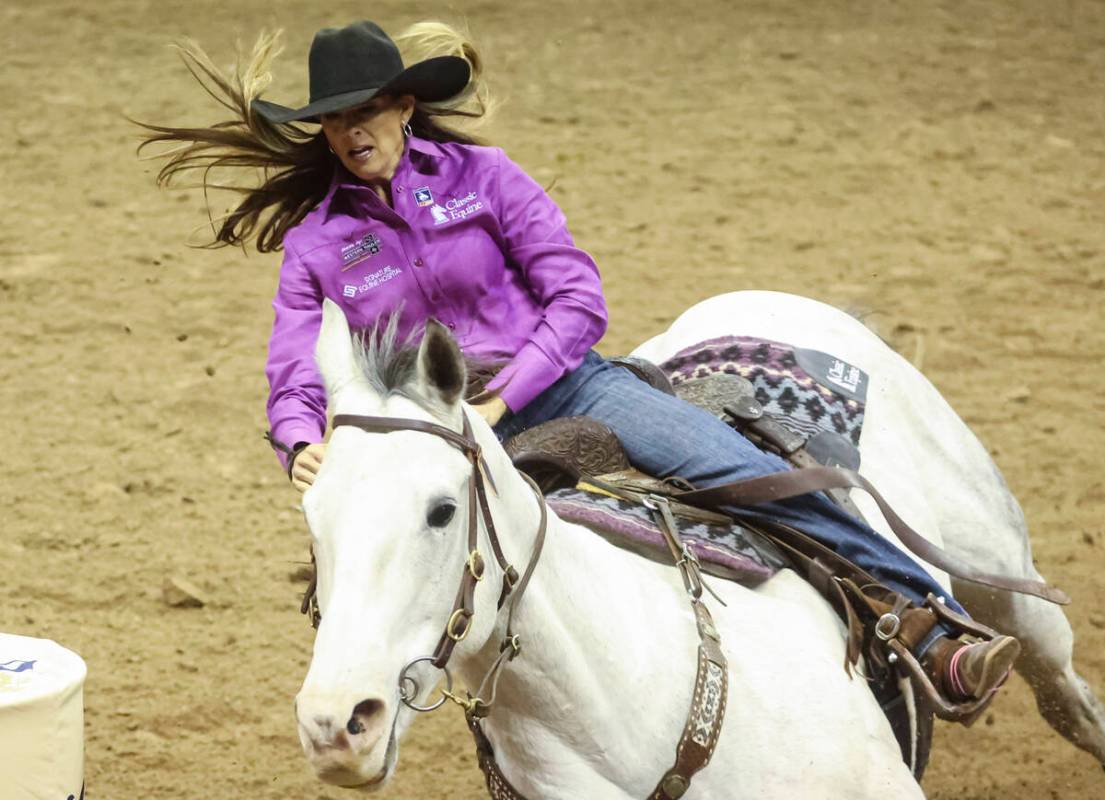 Kassie Mowry, of Dublin, Texas, competes in barrel racing during the fifth go-round of the Nati ...