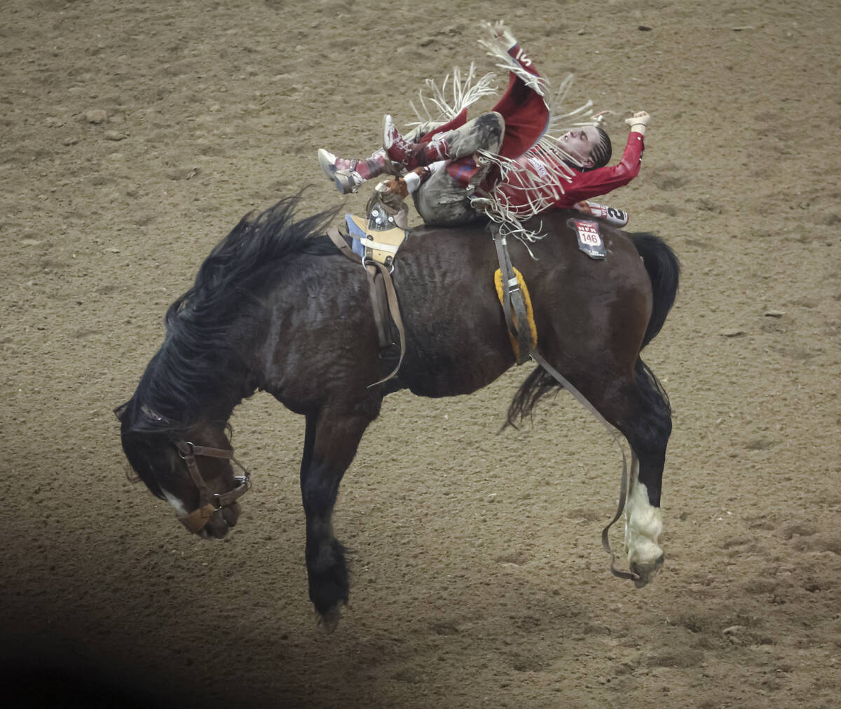 Rocker Steiner, of Weatherford, Texas, competes in bareback riding during the fifth go-round of ...