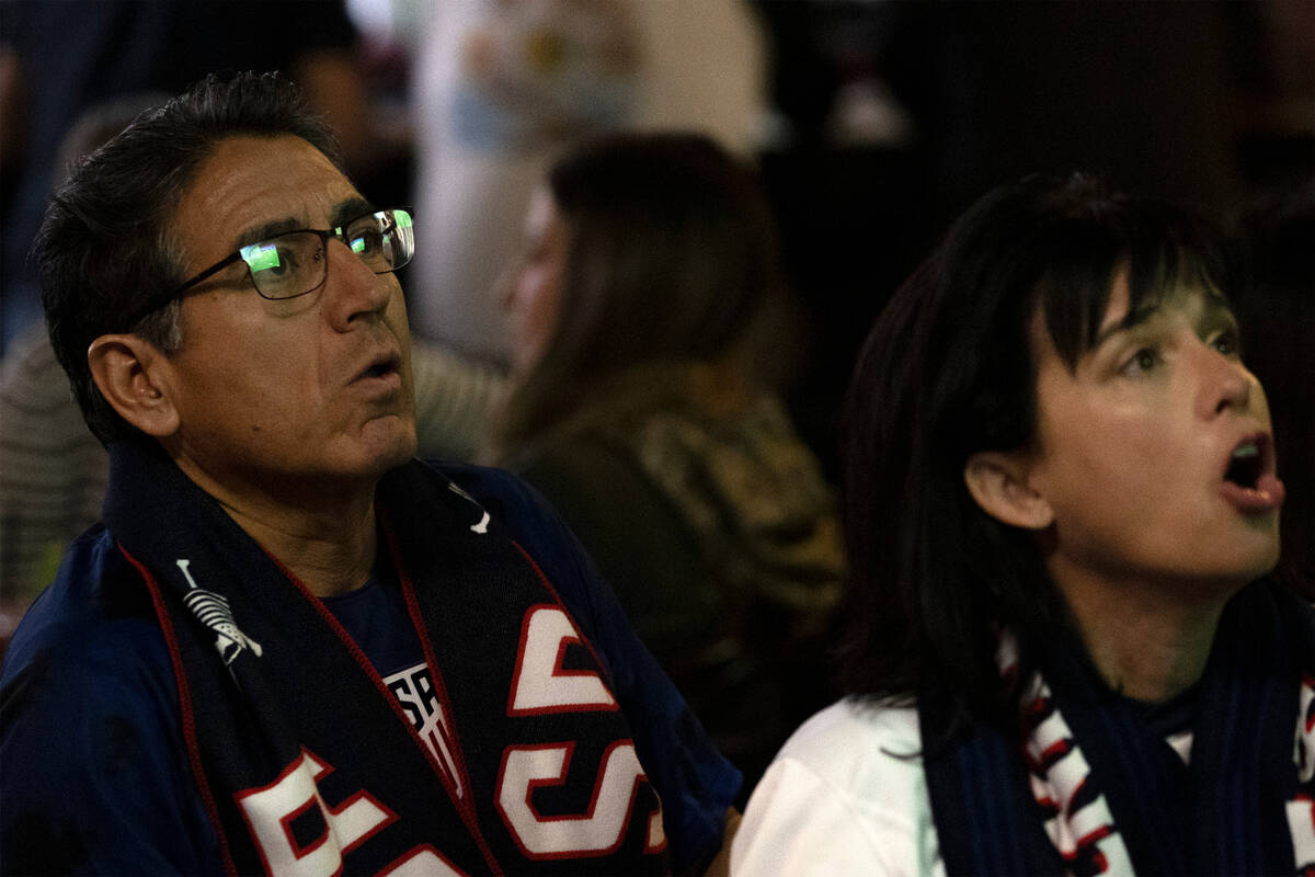 Jose Delgado, left, and Sandy King watch the World Cup round of 16 soccer match between the Uni ...