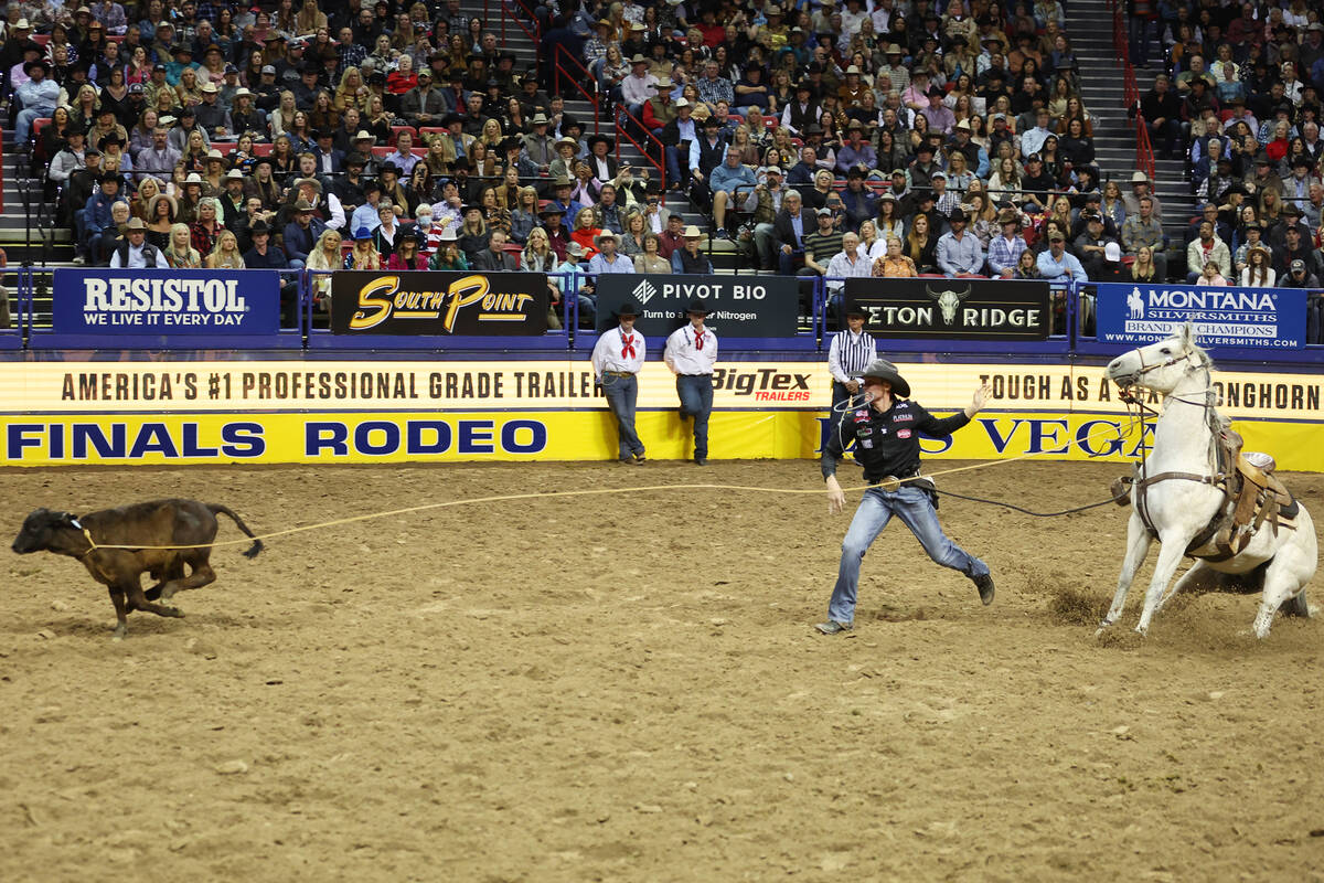 Tuf Cooper competes in the tie-down roping event during the 64th Wrangler National Finals Rodeo ...