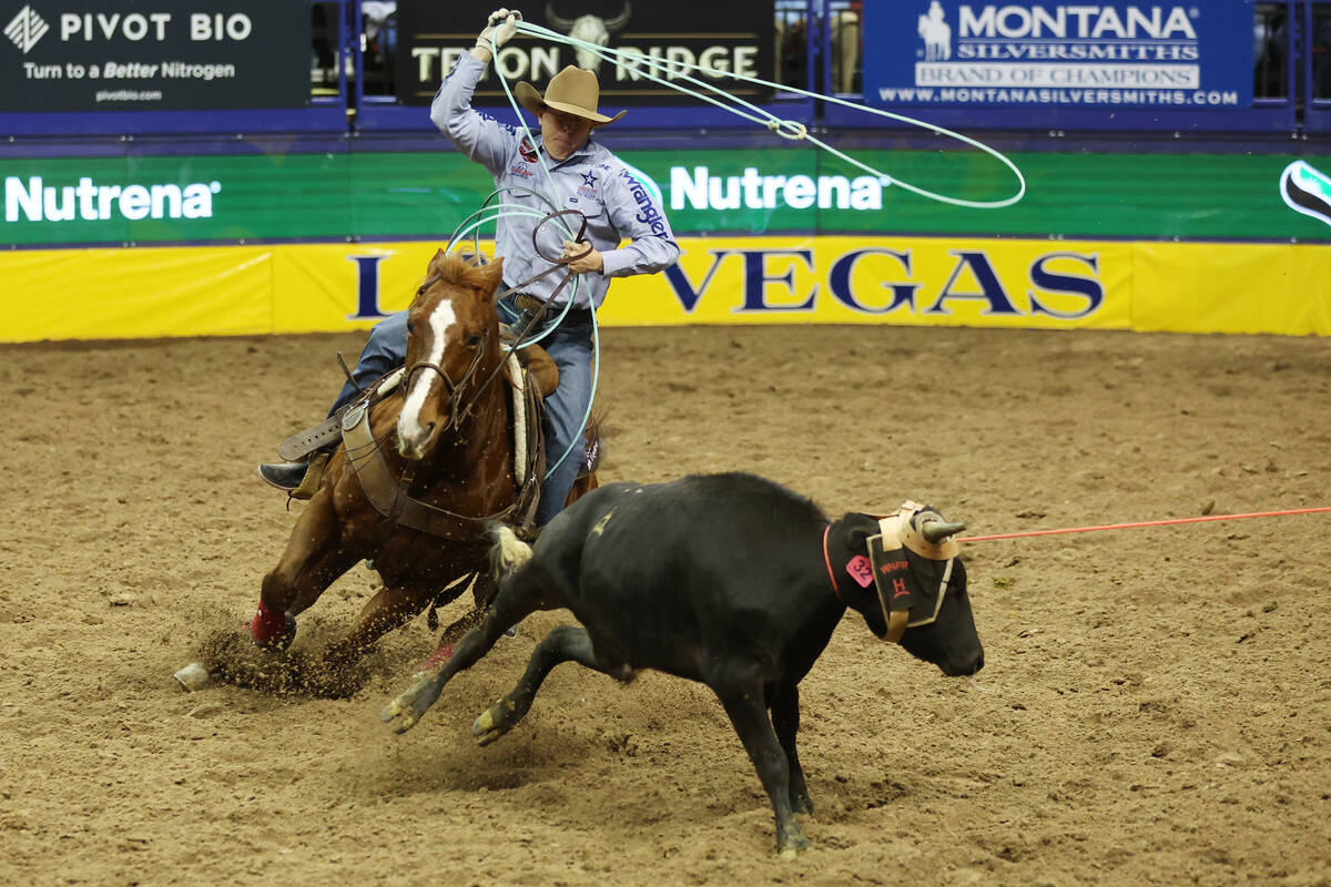 Brye Crites competes in the team roping event in the 64th Wrangler National Finals Rodeo at the ...