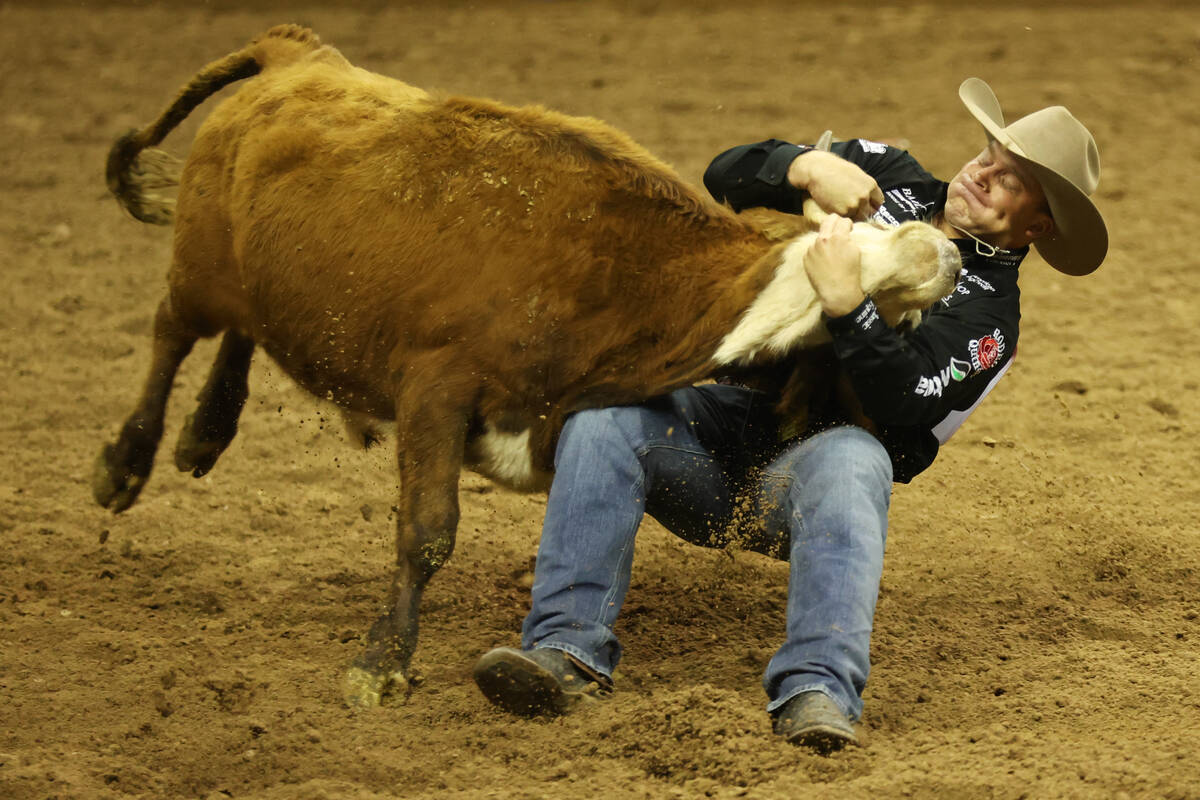 Dakota Eldridge competes in the steer wrestling event in the 64th Wrangler National Finals Rode ...