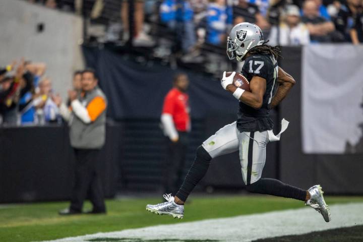 Raiders wide receiver Davante Adams (17) scores a touchdown during the second half of an NFL ga ...
