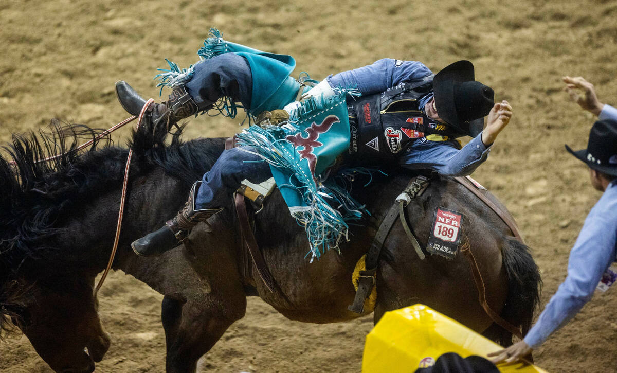 Jess Pope of Waverly, KS., competes during Bareback Riding in the National Finals Rodeo Da ...