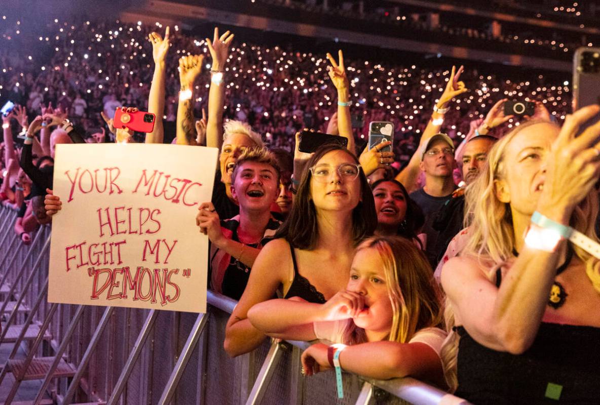 Fans cheer as Dan Reynolds, of Imagine Dragons, performs at Allegiant Stadium, on Saturday, Sep ...