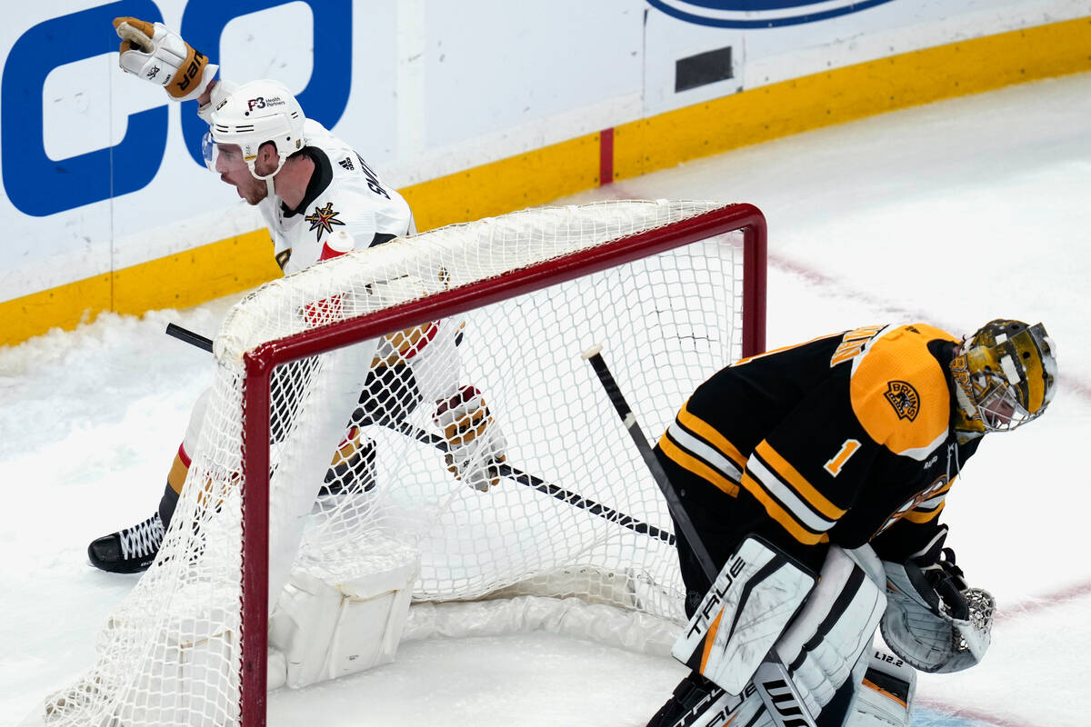 Vegas Golden Knights right wing Reilly Smith, left, celebrates after scoring on Boston Bruins g ...