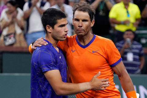 Rafael Nadal, of Spain, right, greets compatriot Carlos Alcaraz after defeating him in the men' ...
