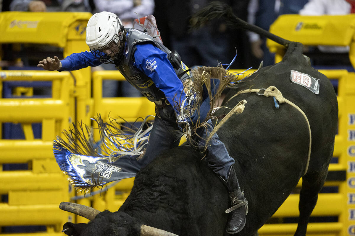 Stetson Wright, of Milford, Utah, competes in bull riding during the sixth go-round of the Nati ...