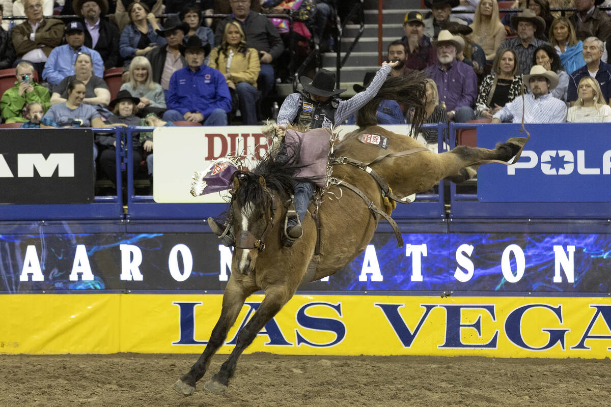 Logan Hay, of Wildwood, Alberta, Canada, competes in saddle bronc riding during the sixth go-ro ...