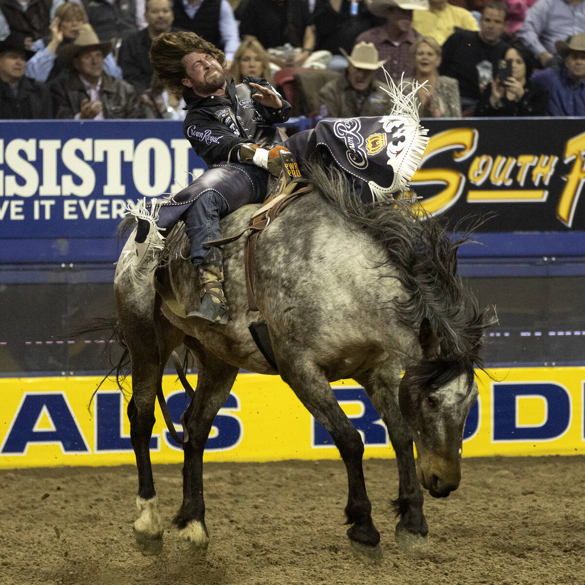 Tilden Hooper, of Carthage, Tex., competes in bareback riding during the sixth go-round of the ...