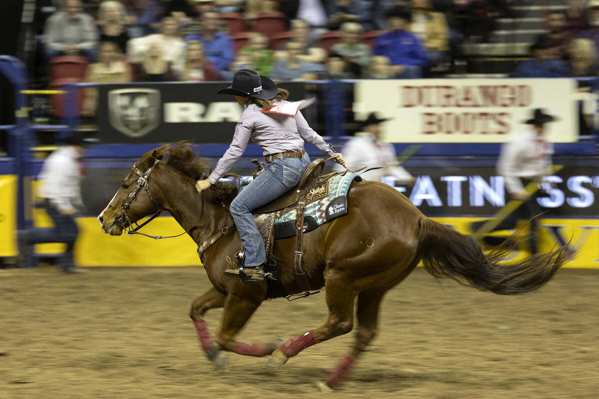 Jordan Briggs, of Tolar, Tex., competes in barrel racing during the sixth go-round of the Natio ...