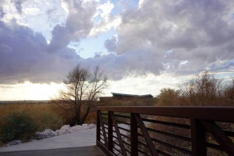 A bridge and path lead from Las Vegas Wash overlooks back to the Clark County Wetlands Park nat ...