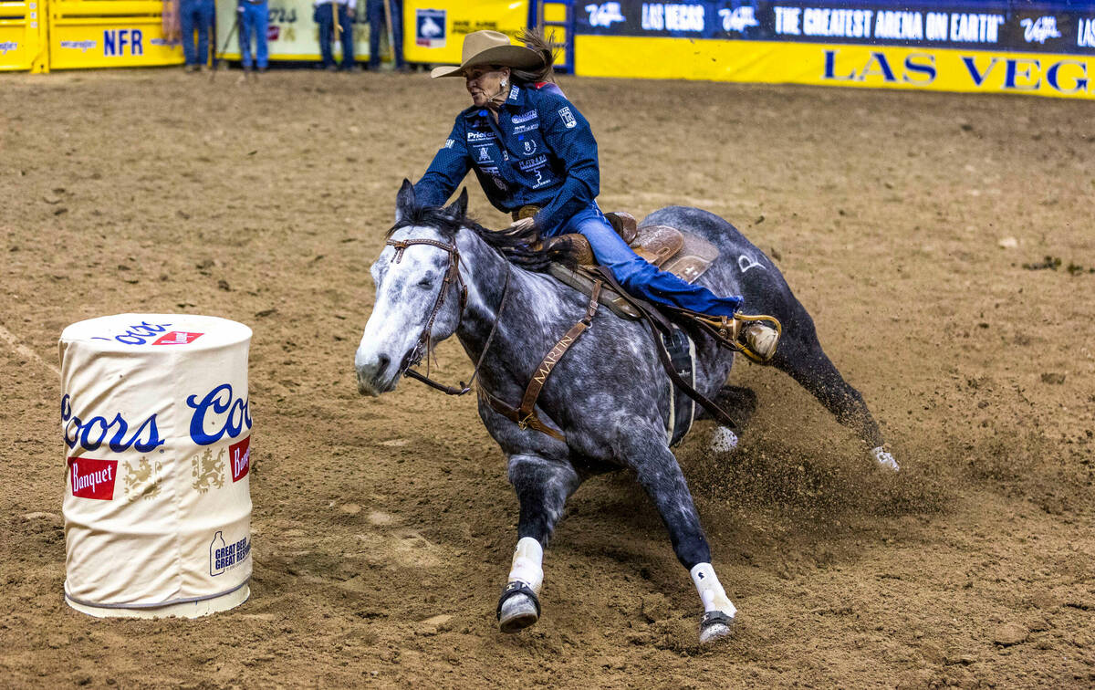 Lisa Lockhart of Oelrichs, SD., approaches the first obstacle during Barrel Racing in the Natio ...