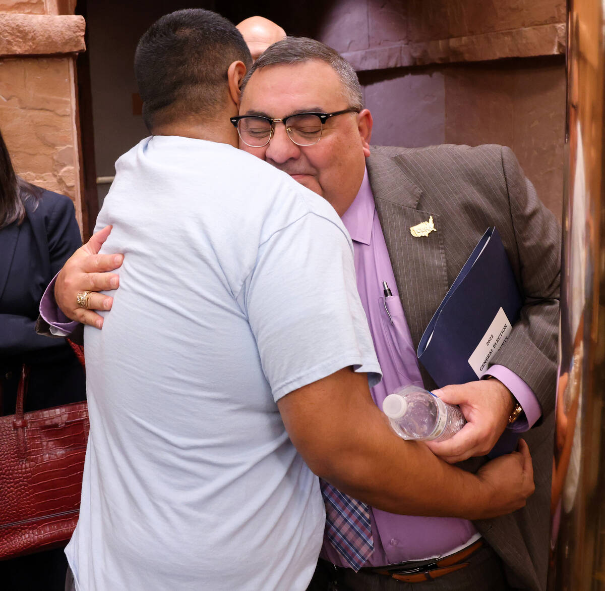 Clark County Registrar of Voters Joe Gloria gets a hug from a supporter after a Clark County Co ...