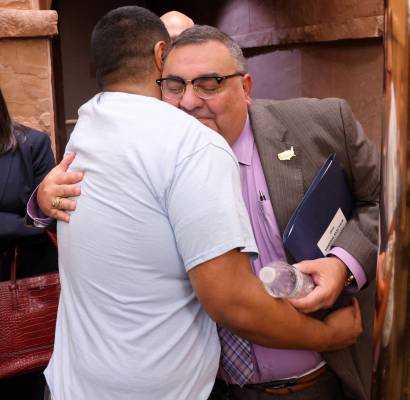 Clark County Registrar of Voters Joe Gloria gets a hug from a supporter after a Clark County Co ...