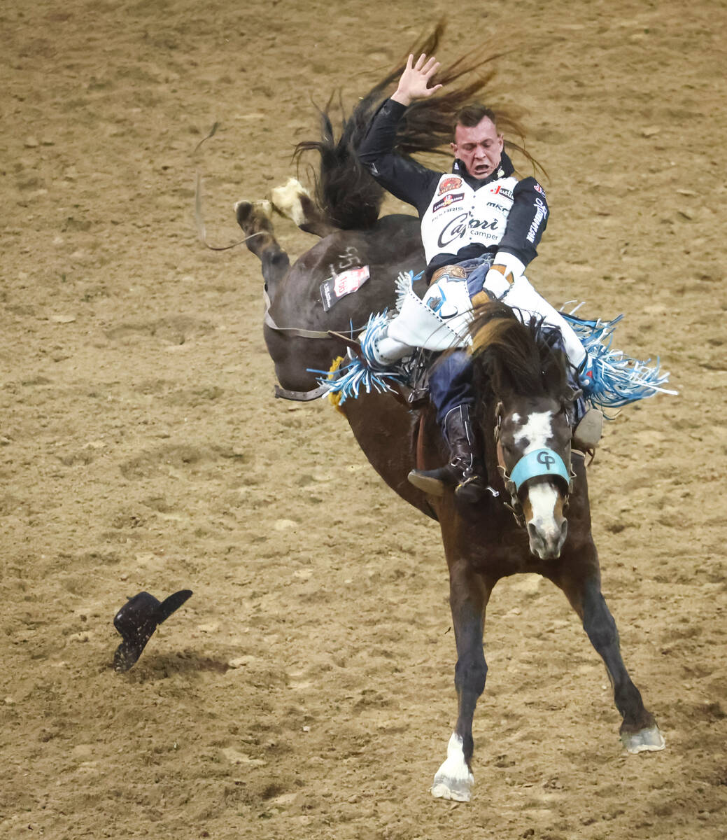 Tim O’Connell, of Zwingle, Iowa, competes in bareback riding during the first night of the Na ...