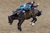 Jess Pope, of Waverly, Kan., competes in bareback riding during the seventh go-round of the Nat ...