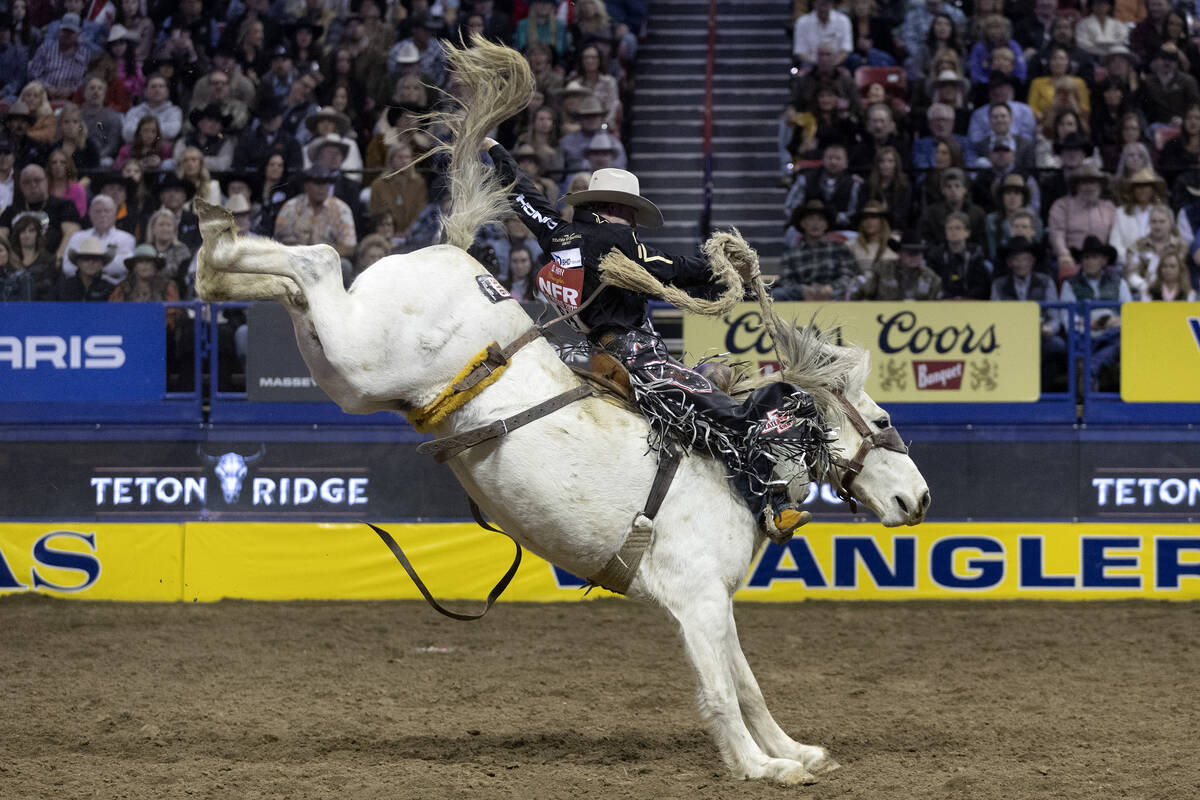 Dawson Hay, of Wildwood, Alberta, Canada, competes in saddle bronc riding during the eighth go- ...