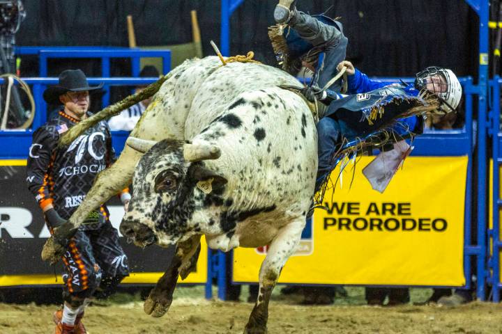 Stetson Wright of Milford, Utah, holds on for time in Bull Riding during the National Finals Ro ...