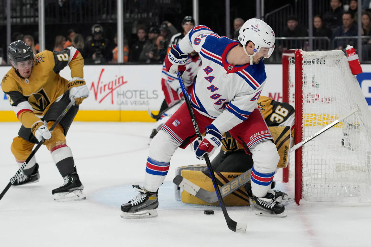 New York Rangers left wing Chris Kreider (20) attempts to tip the puck past Vegas Golden Knight ...