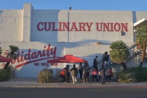 Members of the Culinary Union are walking into front of the office on Thursday, Oct. 6, 2022. ( ...