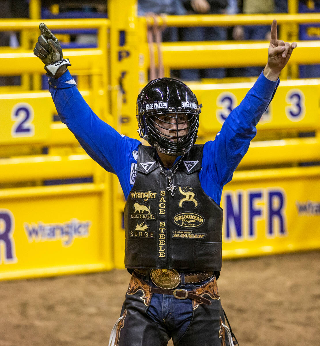 Sage Kimzey of Strong City, Okla., celebrates a great ride on Risky Business in Bull Riding dur ...