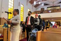 FILE - People line up to speak during a reparations task force meeting at Third Baptist Church ...