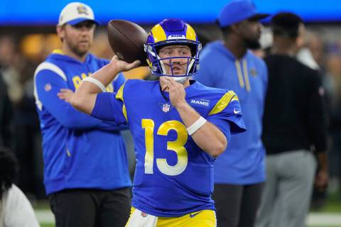 Los Angeles Rams quarterback John Wolford warms up before an NFL football game against the Las ...