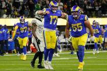 Los Angeles Rams quarterback Baker Mayfield (17) celebrates a touchdown by wide receiver Van Je ...