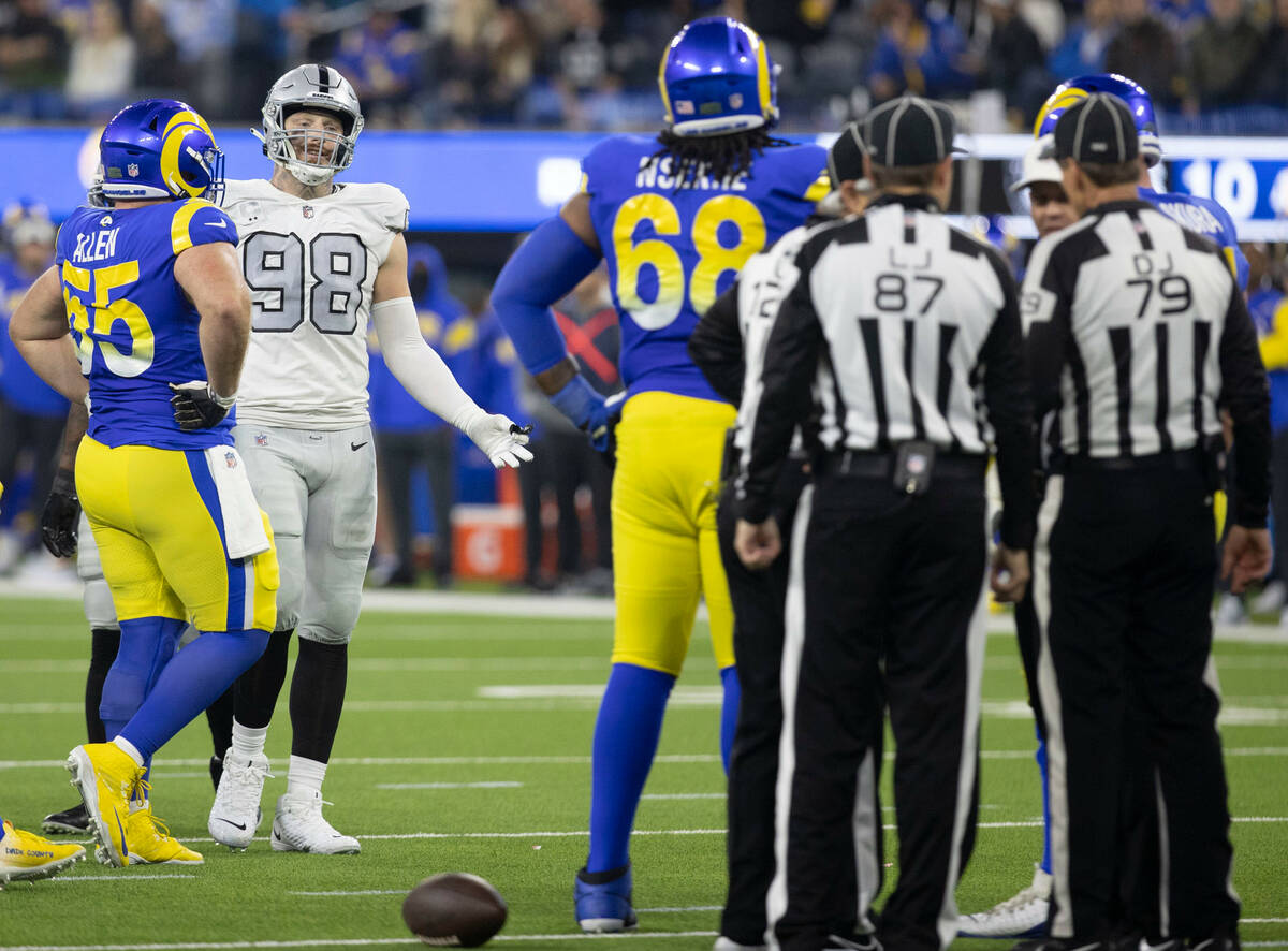 Raiders defensive end Maxx Crosby (98) reacts to a flag that reversed a sack he had during the ...