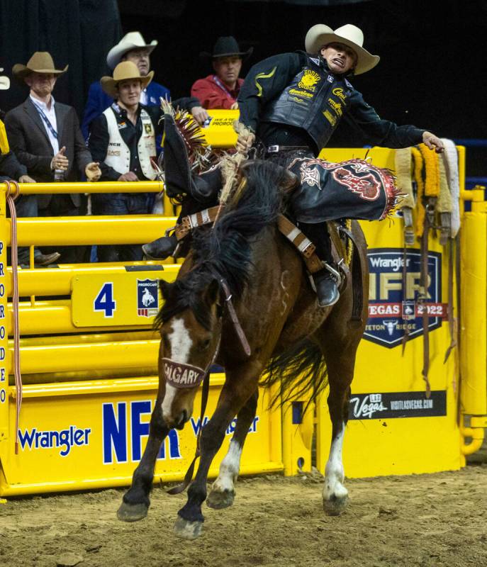 Logan Hay of Wildwood, Alberta, leans back on his ride in Saddle Bronc Riding during the Nation ...