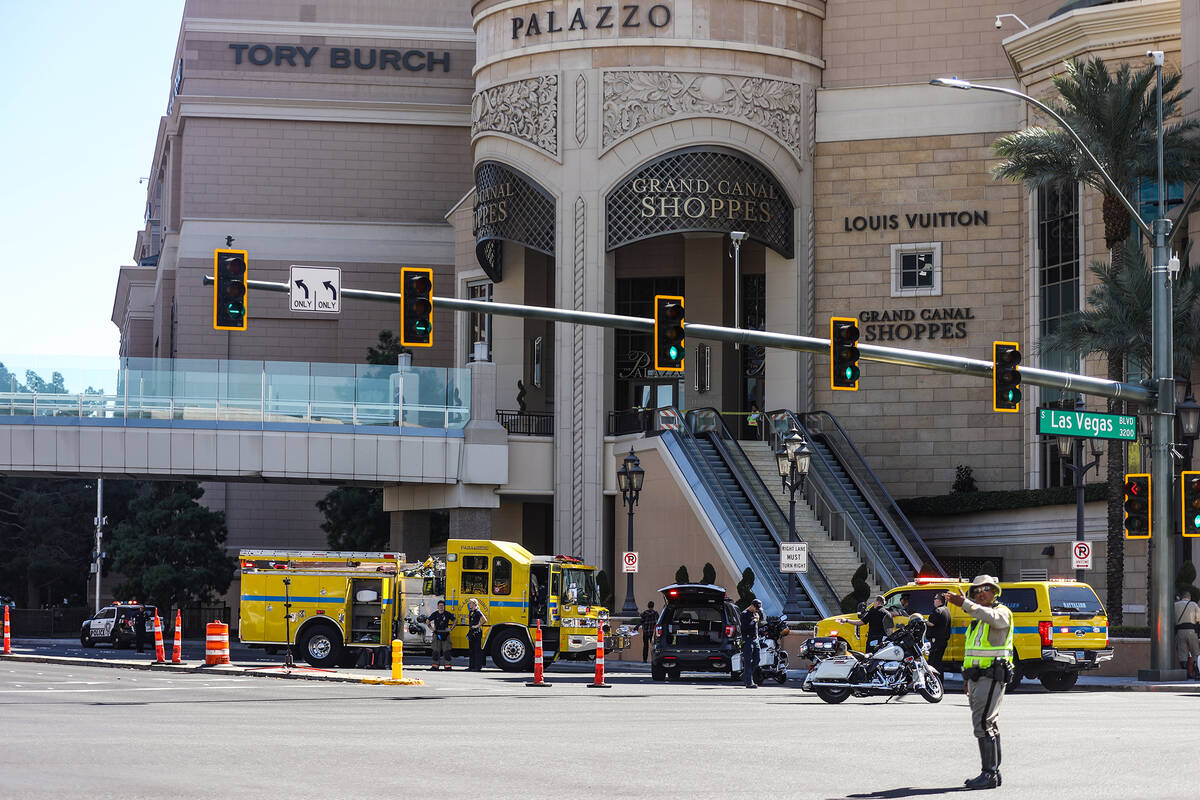 Police at the scene where multiple people were stabbed in front of a Las Vegas Strip casino on ...