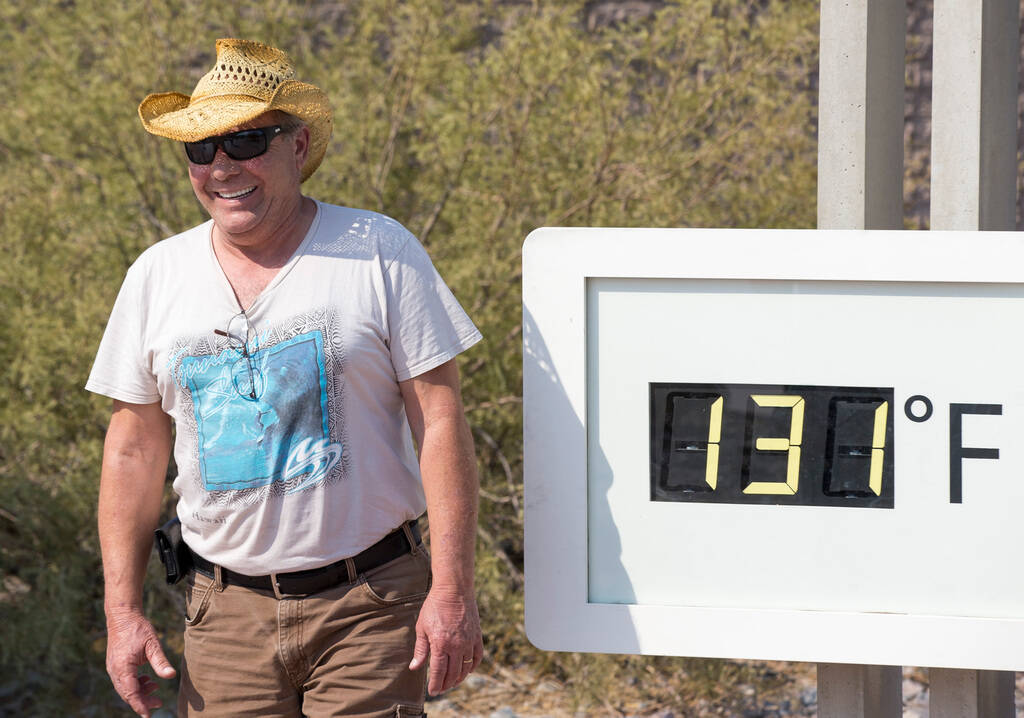Rich Salvatore of Las Vegas poses at the Furnace Creek Visitor Center thermometer in Death Vall ...