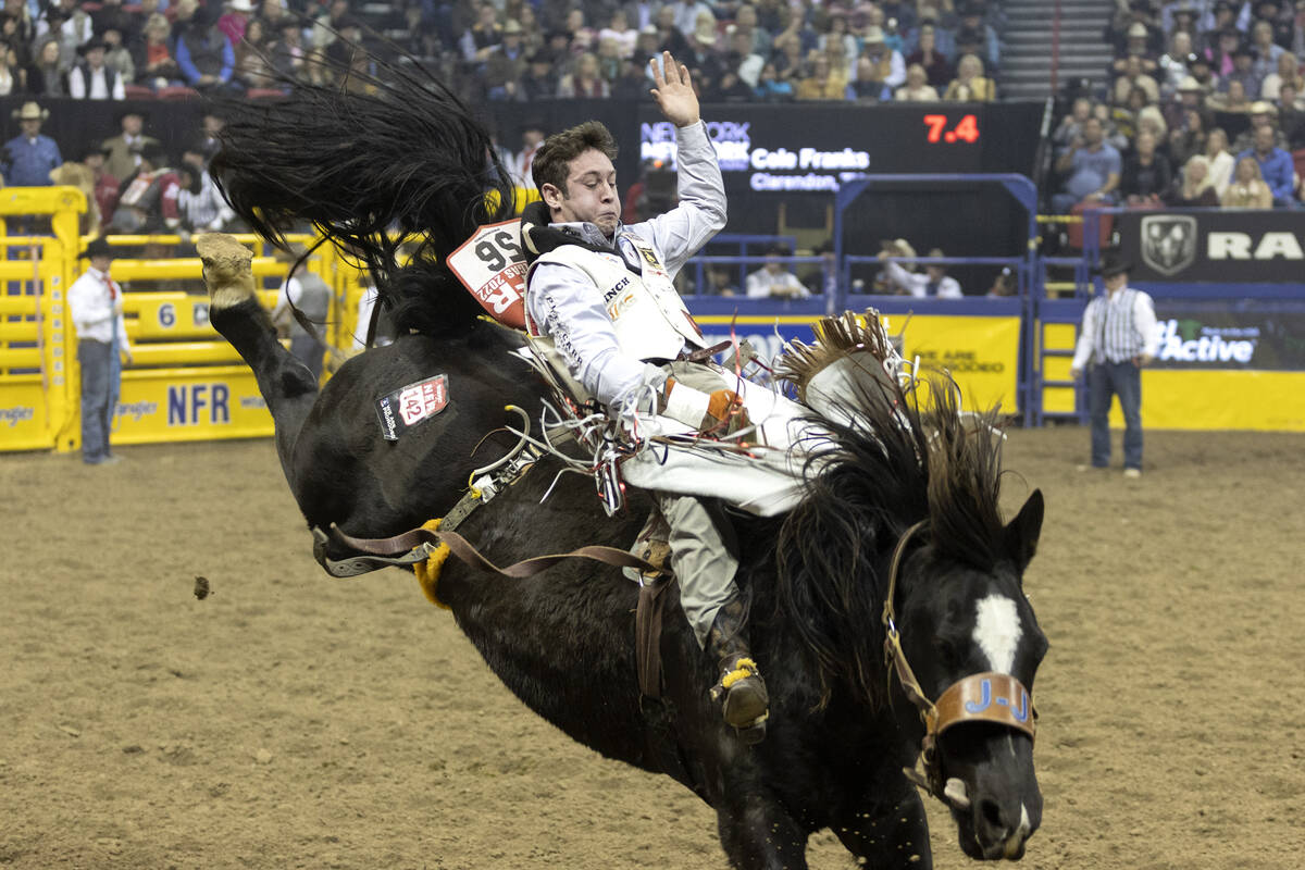 Cole Franks, of Clarendon, Tex., competes in bareback riding during the sixth go-round of the N ...