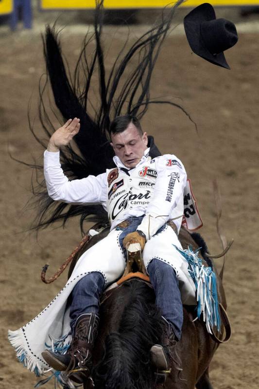 Tim O’Connell, of Zwingle, Iowa, competes in bareback riding during the seventh go-round ...