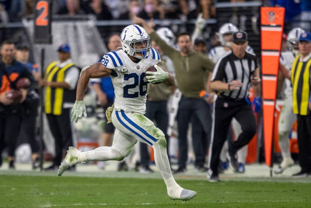 Indianapolis Colts running back Jonathan Taylor (28) runs into Raiders territory during the sec ...