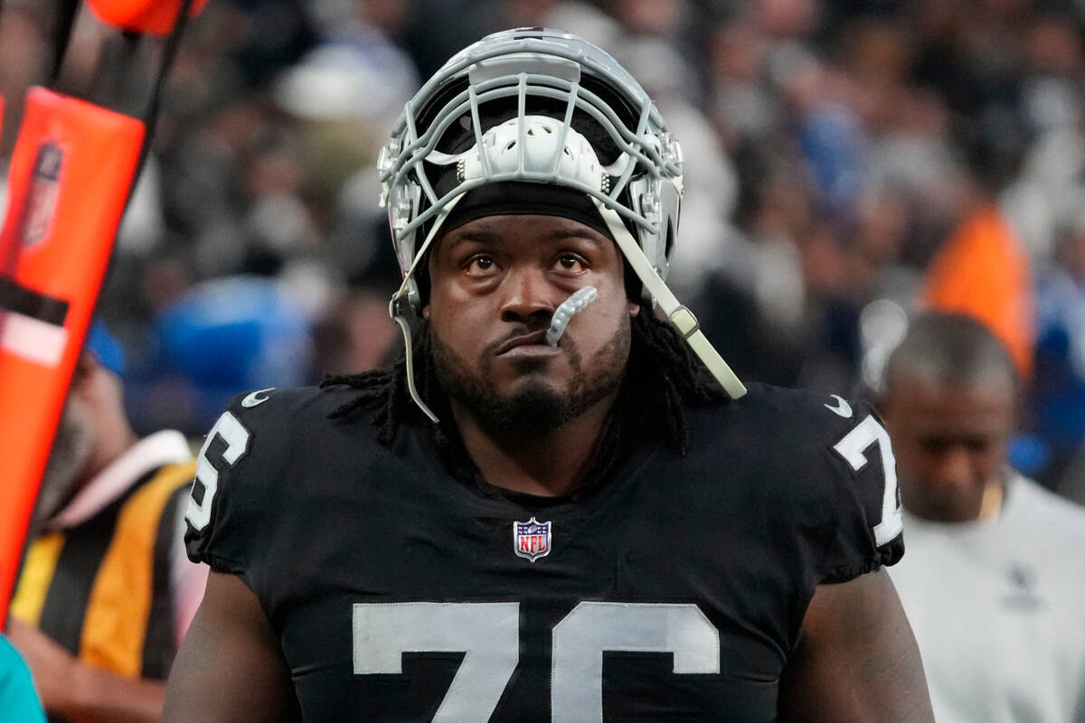 FILE - Las Vegas Raiders guard John Simpson (76) leaves the field against the Indianapolis Colt ...