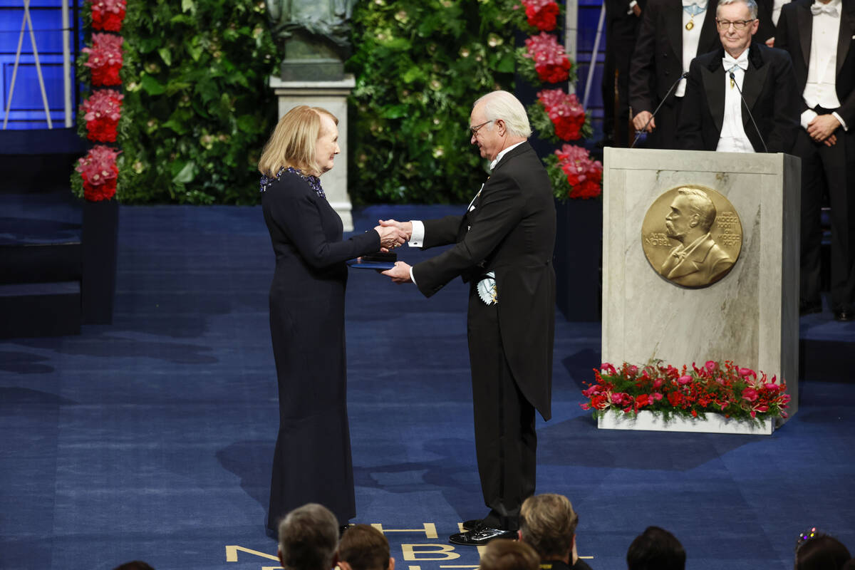 Annie Ernaux receives the 2022 Nobel Prize in literature from King Carl Gustaf of Sweden during ...