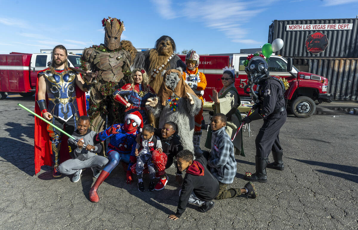 Costumed characters pose with invited guests as the UMC Lions Burn Care Center hosts the &#x20 ...