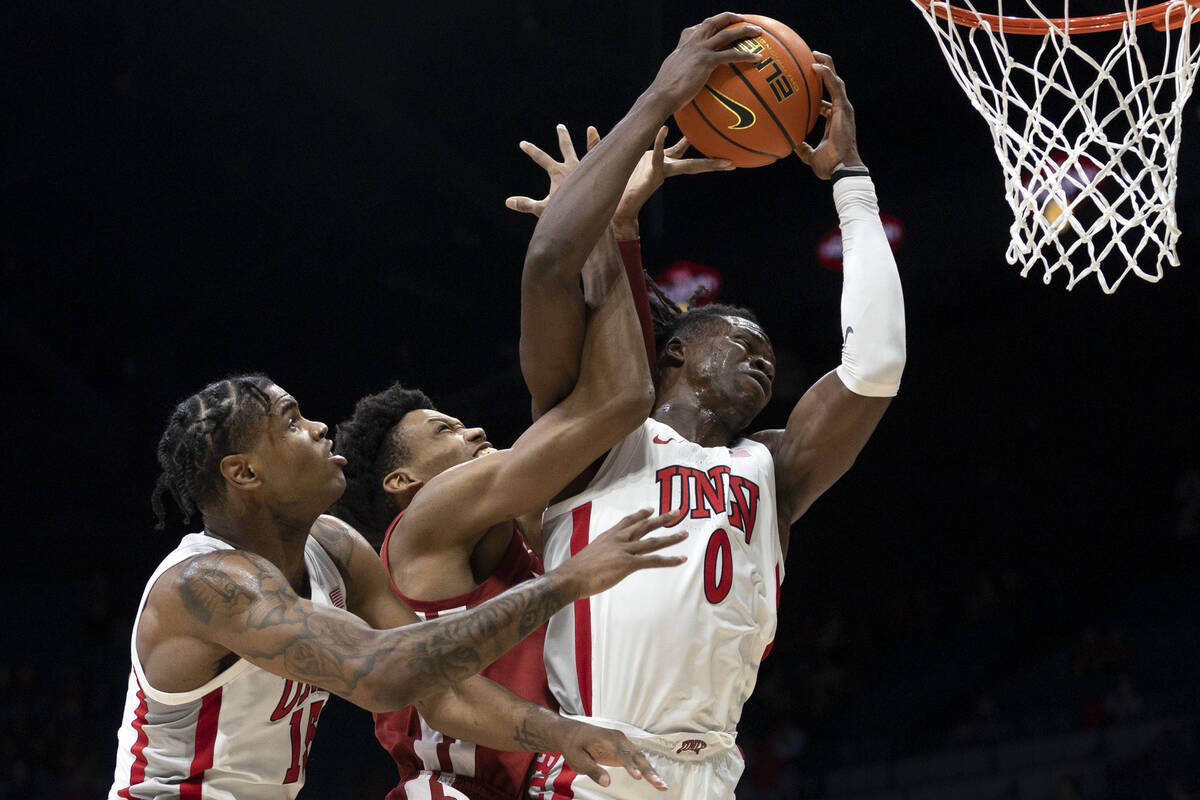 UNLV Rebels forward Victor Iwuakor (0) blocks a shot by Washington State Cougars forward DJ Rod ...