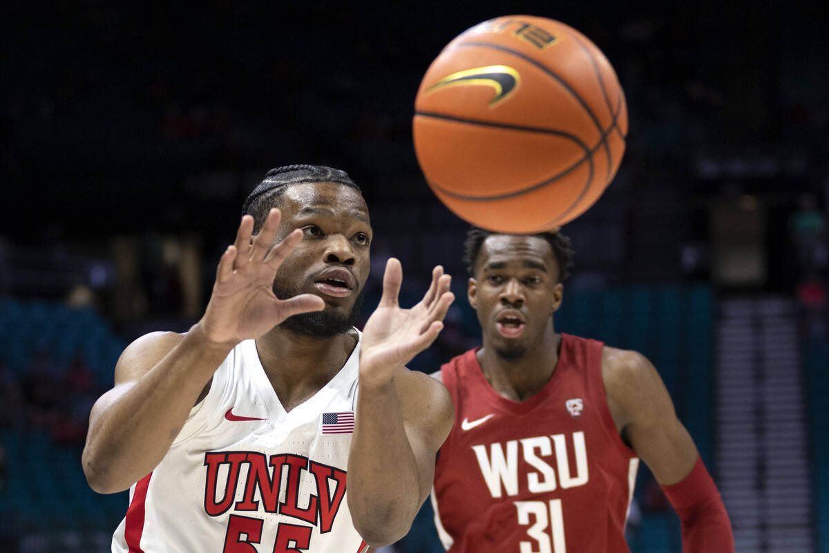 UNLV Rebels guard EJ Harkless (55) receives a pass while Washington State Cougars guard Kymany ...