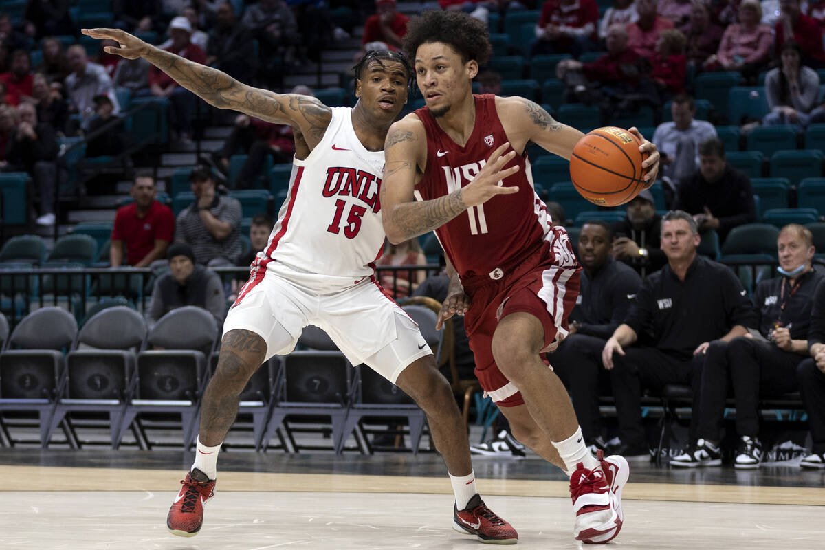 UNLV Rebels guard Luis Rodriguez (15) defends against Washington State Cougars forward DJ Rodma ...